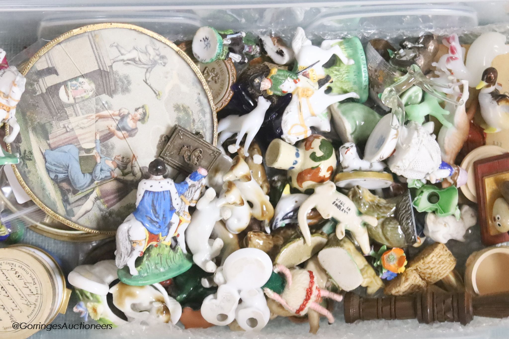 A collection of miniature ceramic and glass figures and animals, treen, enamel patch boxes, souvenirs and curios